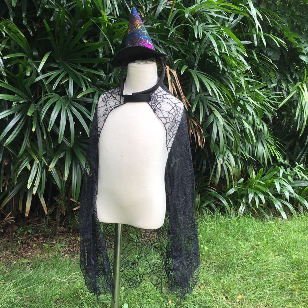 Baby Halloween cobweb cloak from Everything Baby, kids' spider-themed costume with web details for pretend play and costume fun.