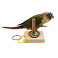 Colorful stacking ring bird toy set for parrots, featuring small rings for bird play and tricks on a tabletop.