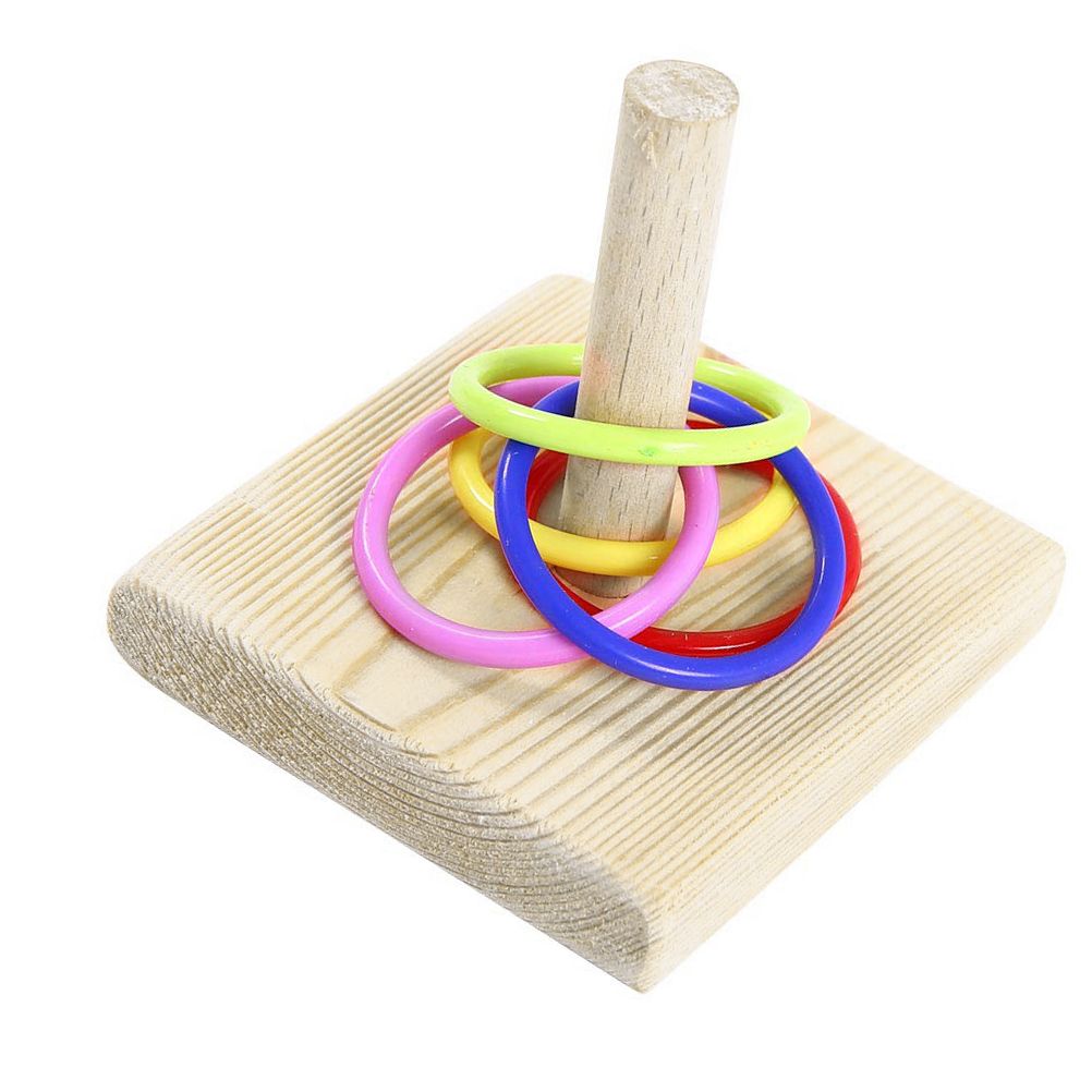 Small stacking ring bird toy set for parrots, featuring colorful rings for play and bird tricks on a tabletop.
