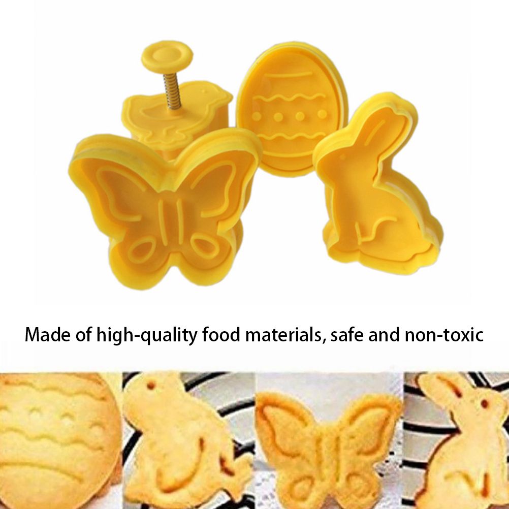 Set of four plastic fondant cutters with butterfly, rabbit, chick, and Easter egg shapes for cake decorating and baking.
