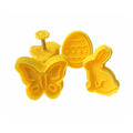 Set of 4 plastic fondant cutters featuring butterfly, rabbit, chick, and Easter egg shapes for cake decorating and baking.