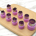 Set of 9 cartoon fruit and vegetable cutter molds for baking and fondant decoration, perfect for cake and biscuit shaping.