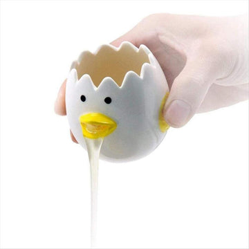 Baby chick-shaped ceramic egg separator from Everything Baby, designed for kitchen use to separate egg yolks easily.