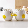 Ceramic chick-shaped egg yolk separator from Everything Baby, designed for kitchen use, ideal for separating egg whites from yolks.