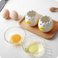 Ceramic chick-shaped egg separator for kitchen, designed to easily separate egg yolks from whites, ideal for baking and cooking.