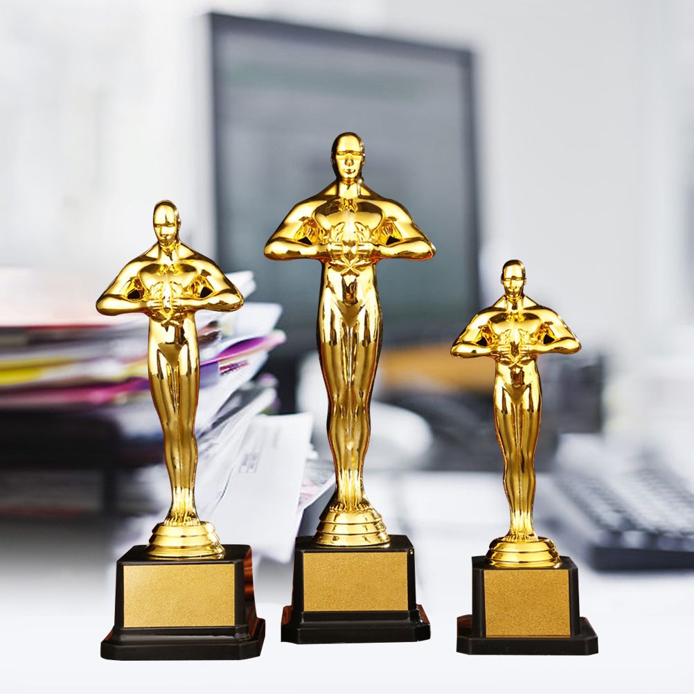 Gold plated trophy featuring a little golden man, designed for kids' outdoor play competitions, by Everything Baby.