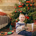 Electric Christmas train set with lights, music, and railway tracks for kids, battery operated holiday ride-on toy by Everything Baby.