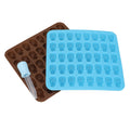 Two skull-shaped silicone ice cube trays in brown and blue for Halloween decor, desserts, and chocolates.
