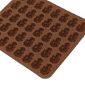 Brown and blue skull silicone mold ice cube tray for Halloween decor, perfect for desserts, chocolates, or ice.