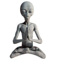 Garden art sculpture of a meditating extraterrestrial figurine by Everything Baby, suitable for outdoor or indoor garden and lawn decor.