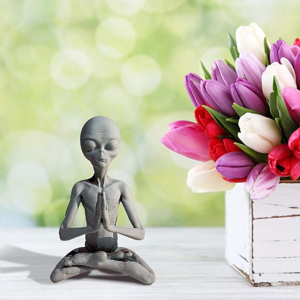 Meditating extraterrestrial garden sculpture by Everything Baby, outdoor lawn decor for home or garden outdoor space.