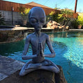 Meditating extraterrestrial garden sculpture by Everything Baby, outdoor lawn decor figurine for home and garden decor.