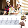 Heart-shaped silicone ice cream mold with four cavities, ideal for homemade popsicles, cakes, and jellies for kids.