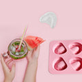 Silicone ice cube tray with teeth-shaped molds, fun gag gift for dentist parties, used as novelty ice cubes for drinks.