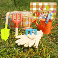 Kids' garden play tools set by Everything Baby with a carrying bag, including shovels, rakes, and watering can for outdoor fun.