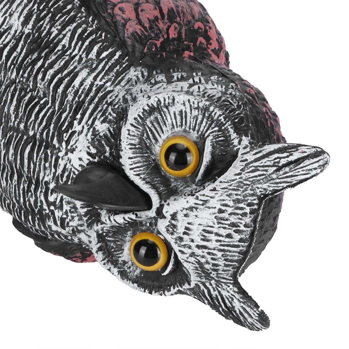 Plastic owl statue decoration for outdoor gardens, used as a bird repeller and hunting decoy in outdoor play and garden settings.