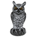 Plastic owl garden decoration and bird repeller, used as outdoor hunting decoy for garden pest control and outdoor decor.