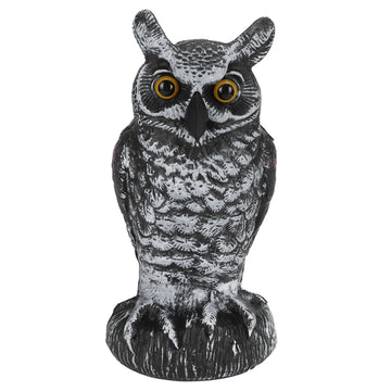 Plastic owl garden decoration and bird repeller, used as outdoor hunting decoy for garden pest control and outdoor decor.