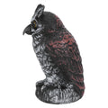 Plastic owl garden decoy with realistic features, used as outdoor hunting predator repeller for garden protection.