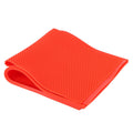 Two beeswax sheets and a rubber comb foundation press mold for beekeeping, in red, used for shaping beeswax foundation.
