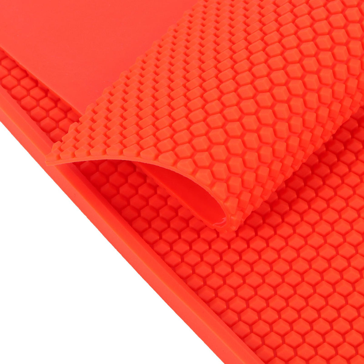 Two red beeswax sheet DIY foundation press molds for beekeeping, with rubber comb shape, used for honey bee hive foundation.