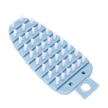 Blue carrot-shaped vegetable brush for scrubbing potatoes, fruits, and vegetables, ideal for kitchen cleaning.