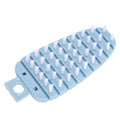 Blue carrot-shaped vegetable brush for scrubbing potatoes, fruits, and vegetables in the kitchen, designed for easy cleaning.