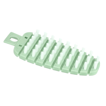 Green carrot-shaped vegetable brush for scrubbing potatoes and fruits, ideal for kitchen cleaning and vegetable preparation.