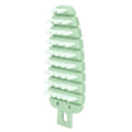 Green carrot-shaped vegetable brush with ergonomic handle for scrubbing potatoes, fruits, and vegetables in the kitchen.