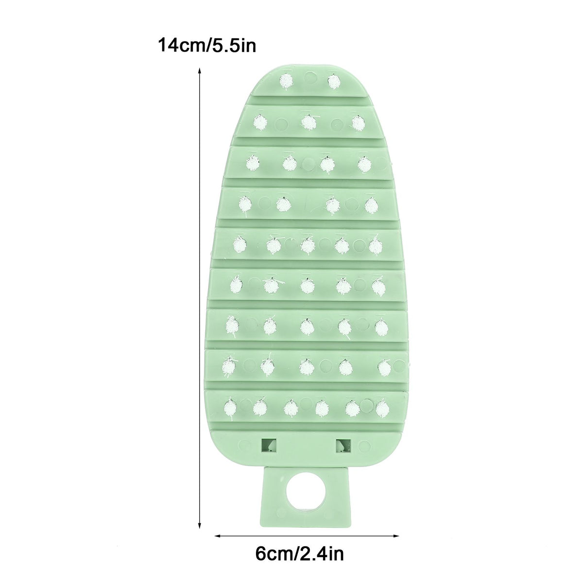 Green carrot-shaped vegetable brush for cleaning potatoes, fruits, and vegetables, designed for kitchen scrubbing and food prep.