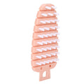 Pink carrot-shaped vegetable and fruit scrub brush with bristles, designed for cleaning vegetables and potatoes in the kitchen.