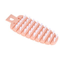 Pink carrot-shaped vegetable brush for scrubbing potatoes, fruits, and vegetables, ideal for kitchen cleaning and food prep.