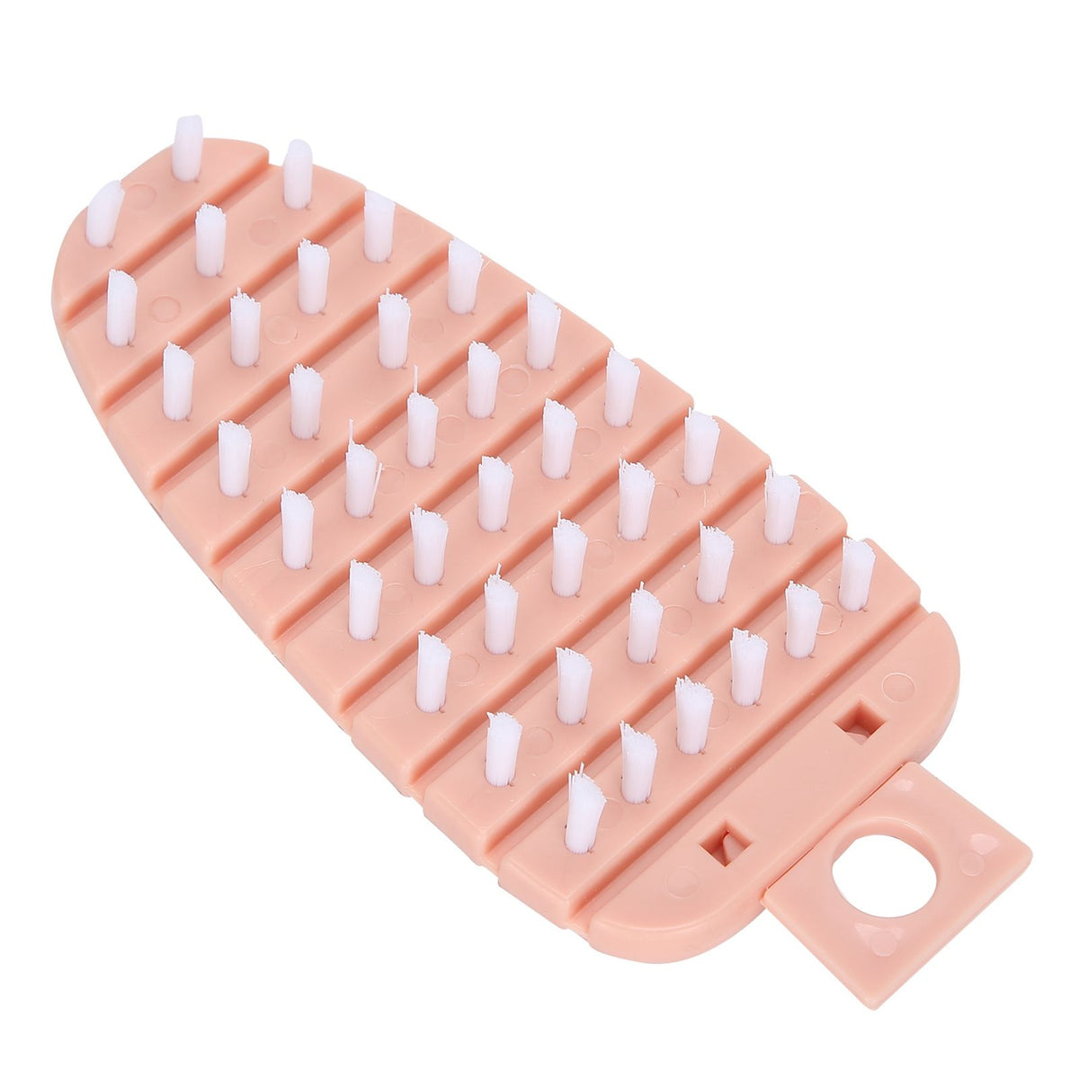 Pink carrot-shaped vegetable brush for scrubbing potatoes, fruits, and vegetables, ideal for kitchen cleaning and food prep.
