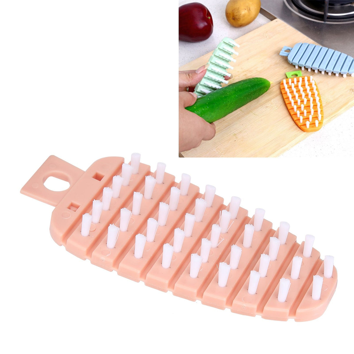 Pink carrot-shaped vegetable and fruit scrub brush for kitchen cleaning, ideal for washing potatoes and vegetables.