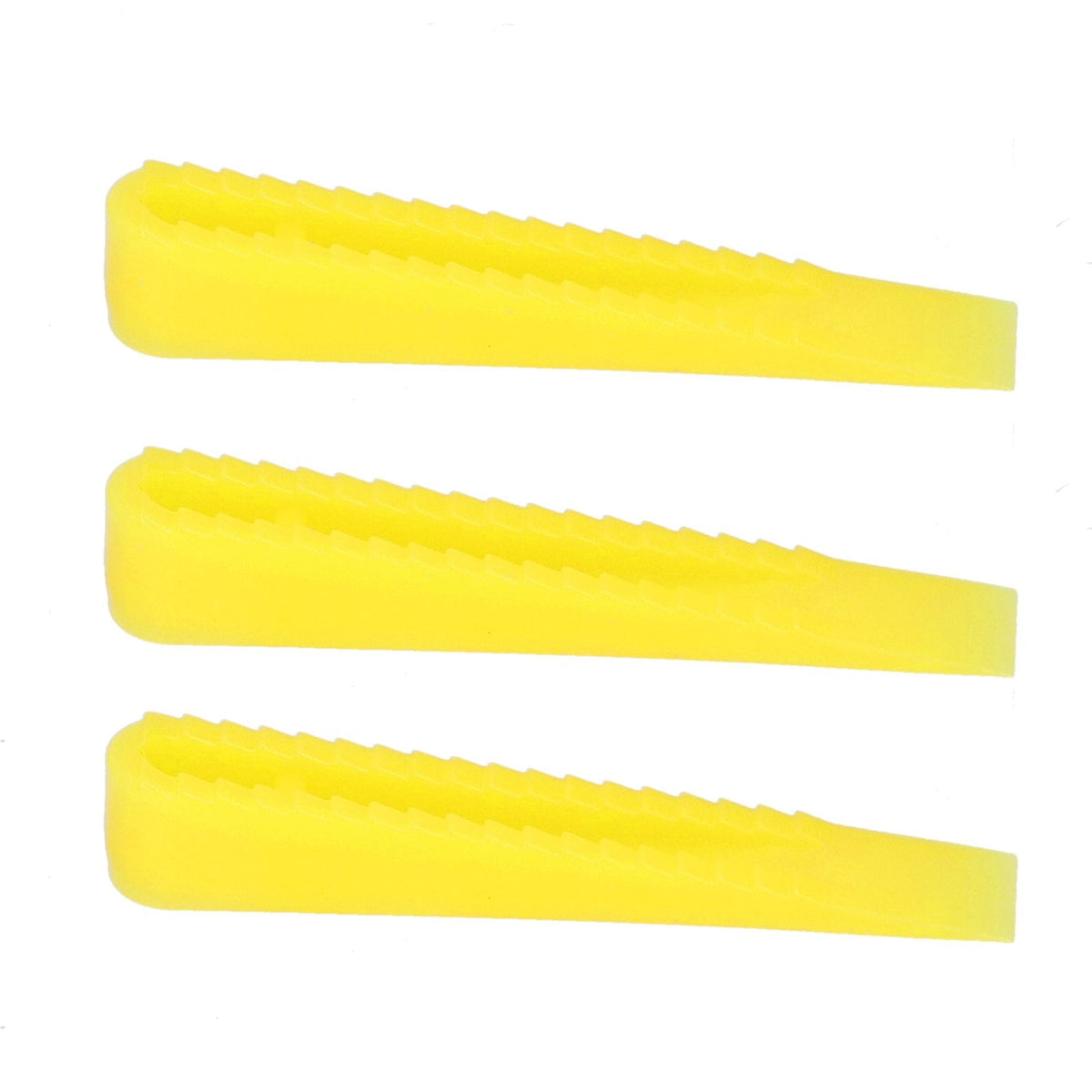 Assorted ceramic tile leveling wedges and system tools for floor construction, designed for precise tile installation.
