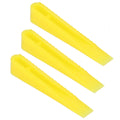 Set of 100 ceramic tile leveling wedges and spacers for floor construction, ideal for precise tile installation and leveling.