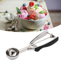 Stainless steel ice cream spoon and melon baller from Everything Baby, perfect for scooping ice cream and fruit balls.