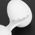 Cute egg-shaped silicone tea infuser strainer for loose leaf tea, ideal for kitchen use and tea brewing.