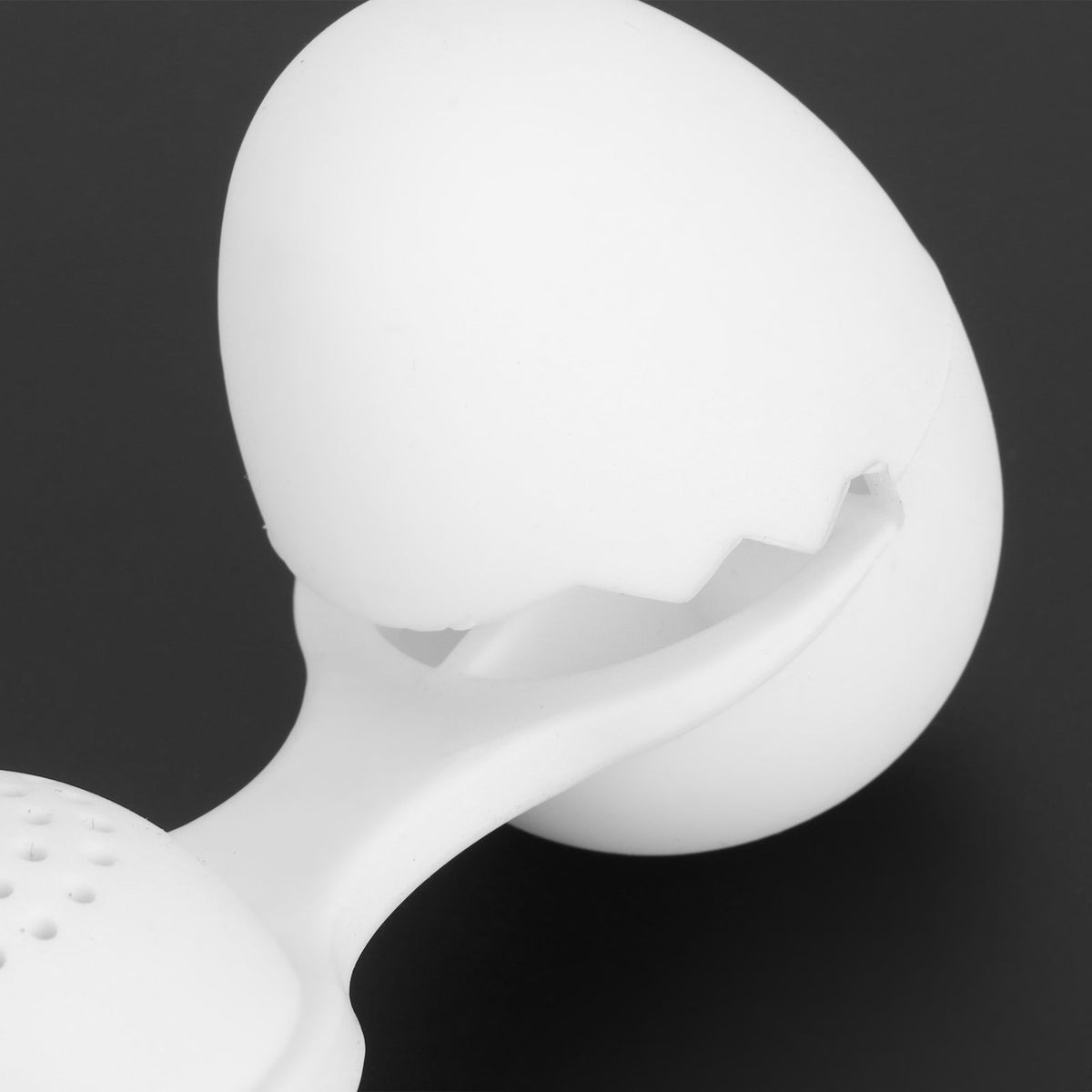 Cute egg-shaped silicone tea infuser strainer for loose leaf tea, ideal for kitchen use and tea brewing.