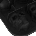 Silicone skull-shaped ice tray with two funnels, ideal for Halloween-themed ice cubes or fun kitchen use.