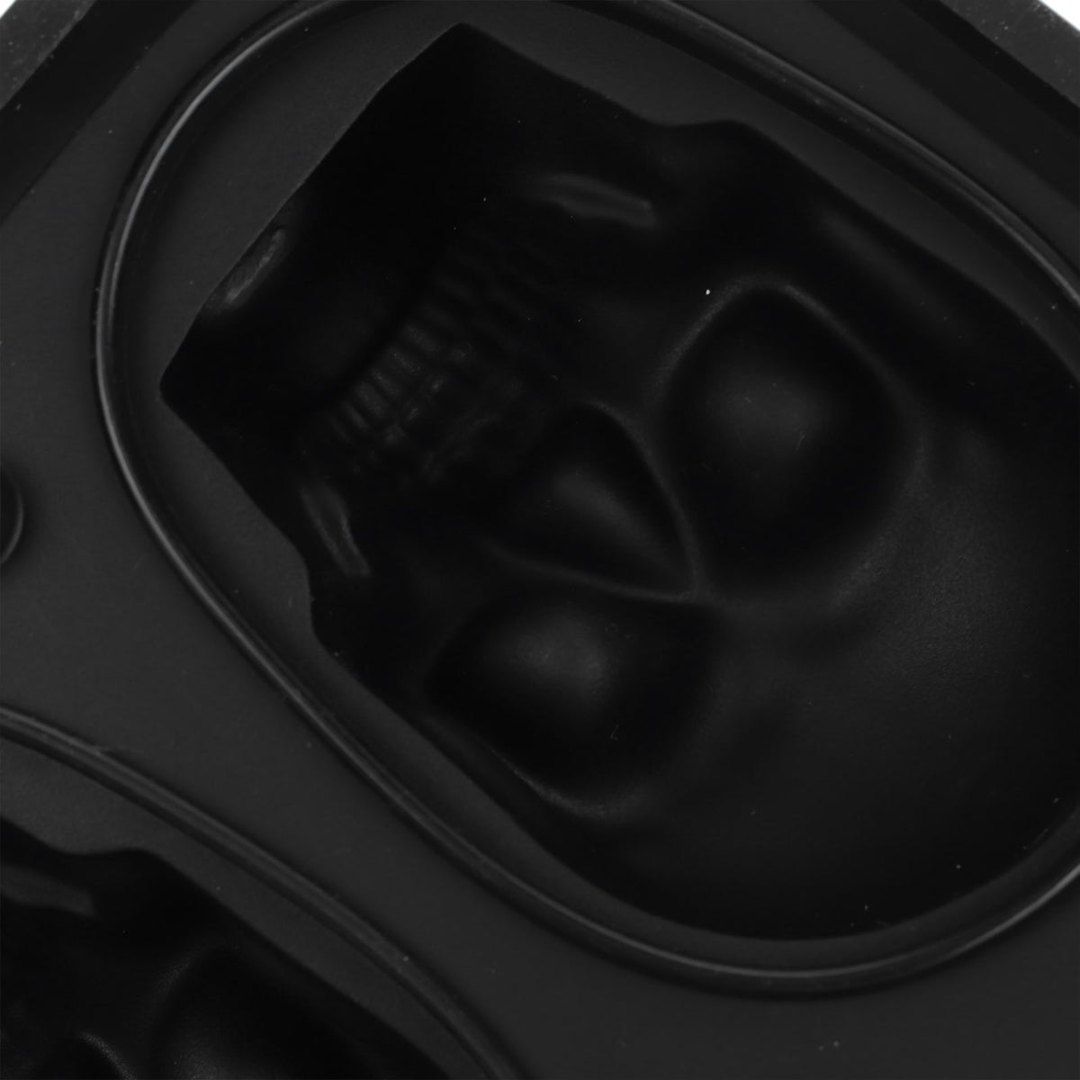 Silicone skull-shaped ice tray with two funnels, designed for Halloween-themed ice cubes, suitable for kitchen use.