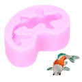 Pink goldfish-shaped silicone mold for fondant or chocolate, perfect for cake decorating and baby-themed treats.