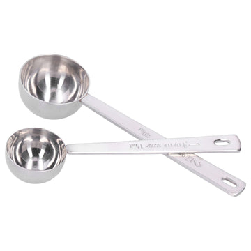 Two stainless steel measuring spoons with long handles from Everything Baby, ideal for measuring milk powder accurately.
