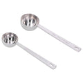 Two stainless steel measuring spoons with long handles, ideal for measuring milk powder, from Everything Baby.