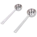 Two stainless steel measuring spoons with long handles for baby milk powder, ideal for precise measurements and outdoor use.