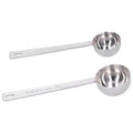 Two stainless steel measuring spoons with long handles for milk powder, ideal for baby feeding and outdoor toy prep.