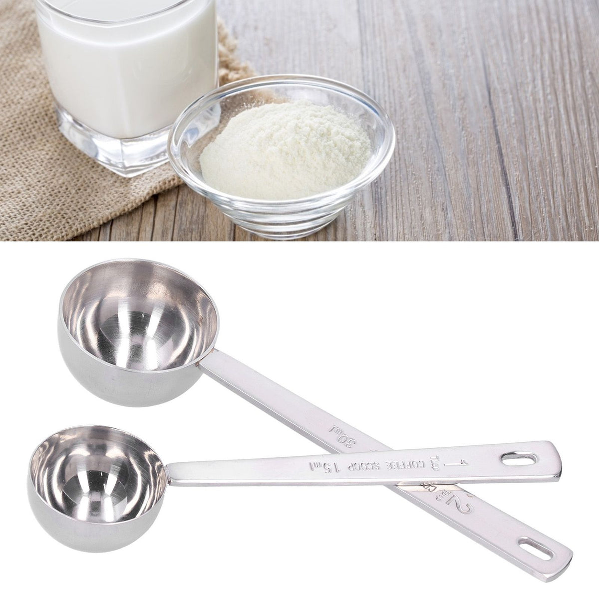 Two stainless steel measuring spoons with long handles, ideal for measuring milk powder, by Everything Baby.