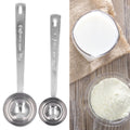 Two stainless steel measuring spoons with long handles for measuring milk powder, suitable for baby feeding and outdoor use.