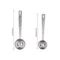 Two stainless steel measuring spoons with long handles, ideal for measuring milk powder in baby and kids outdoor play equipment.
