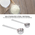 Two stainless steel measuring spoons with long handles, ideal for measuring milk powder for babies, by Everything Baby.